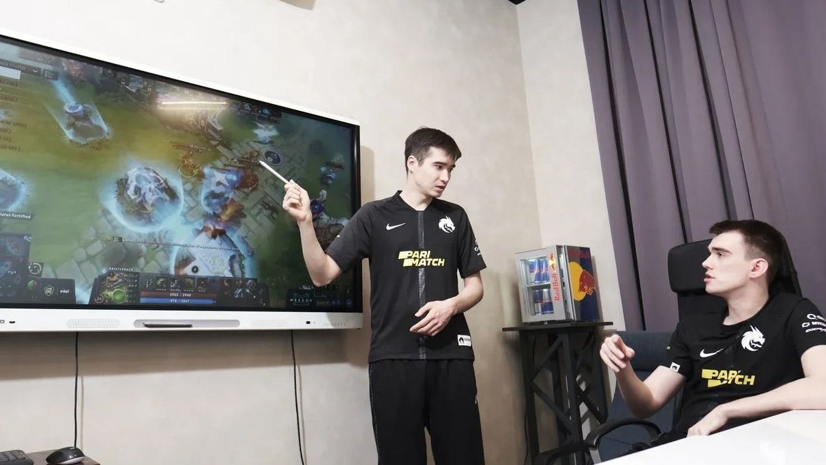 Team Spirit players discussing a Dota 2 game 