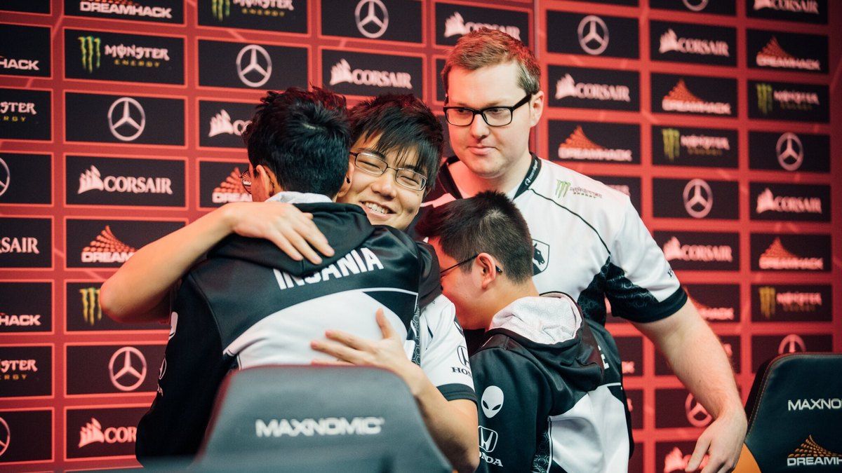 Team Liquid players hugging their coach at DreamLeague