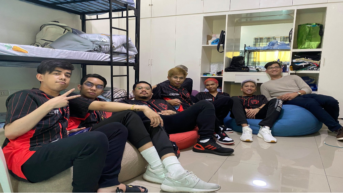 Cignal Ultra team sitting on the floor