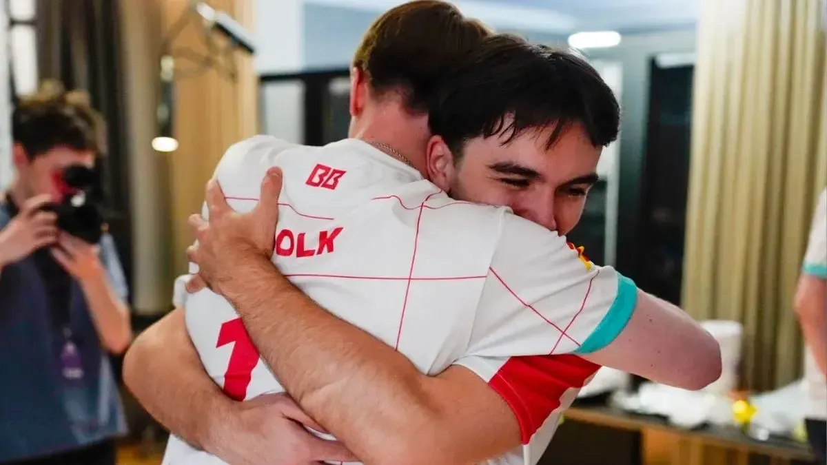 An image of BetBoom Team players sharing a victorious hug